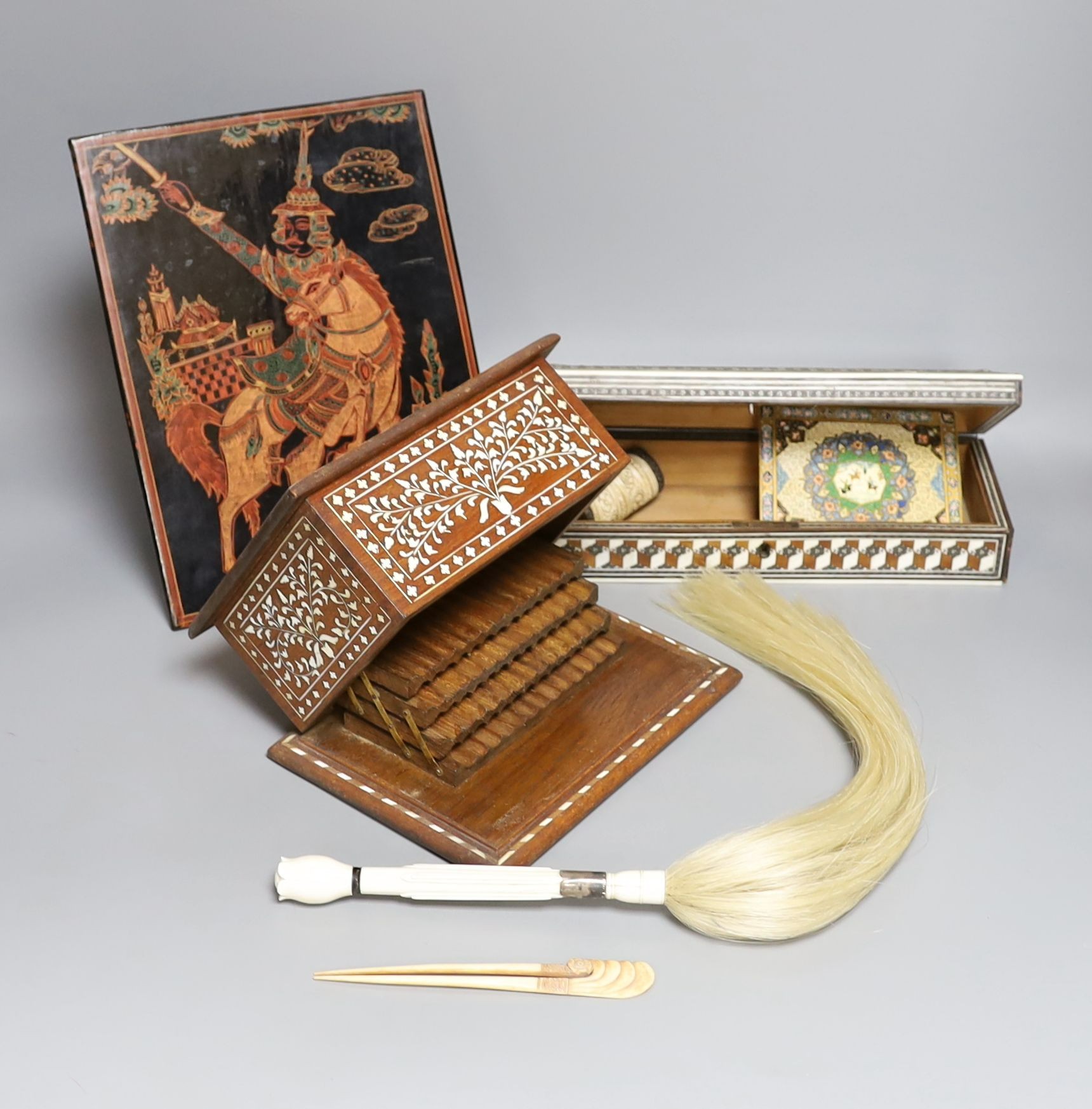 A 19th century ivory handled fly whisk, ivory inlaid sandalwood glove box, carved bone snuff box, bone inlaid cigarette box, a Burmese lacquer panel and a Persian painted ivorine panel